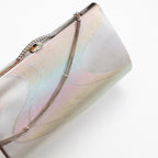 Close-up of iridescent river pattern and textured silver chain detail on vintage Japanese kimono clutch corner.