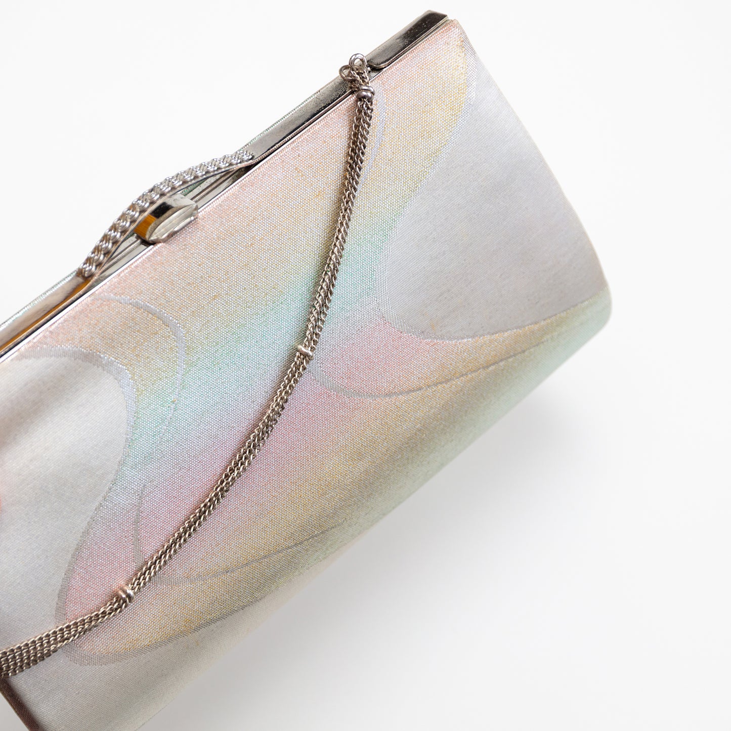 Clutch bag with chain strap on a white background
