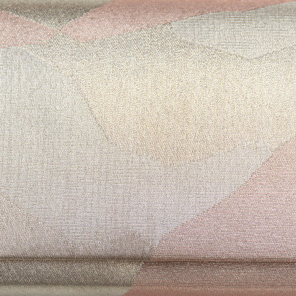 Close-up of textured fabric with geometric pattern in pink and silver tones, detail of the abstract design on the front of the vintage silk clutch bag.
