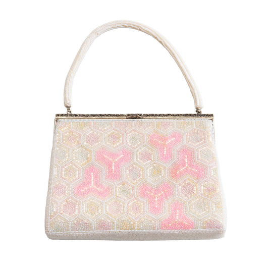 Beaded vintage Japanese white and pink handbag with pink floral pattern on a white background