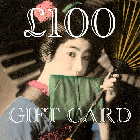 Close-up of the textured, stitched fabric with vibrant Hunted and Stuffed branding tag on the gift card edge