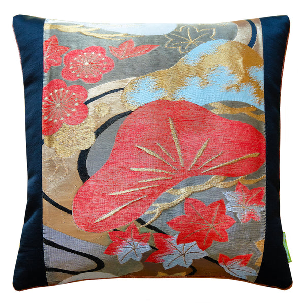 Black obi pillow with orange matsu pine and flowers over winding stream by Hunted and Stuffed.