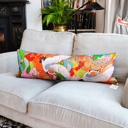 Long cranes bolster pillow with blue velvet back on grey sofa by Hunted and Stuffed