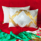Close-up of gold embroidery detailing on the textured metallic geometric surface of the upcycled Japanese Obi cushion.