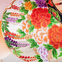 Antique Japanese silk cushion detail with wisteria flowers