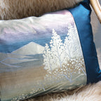 Close-up of the Blue Mountain Silk Velvet Cushion's textured fabric surface highlighting its rich, deep blue hue and subtle