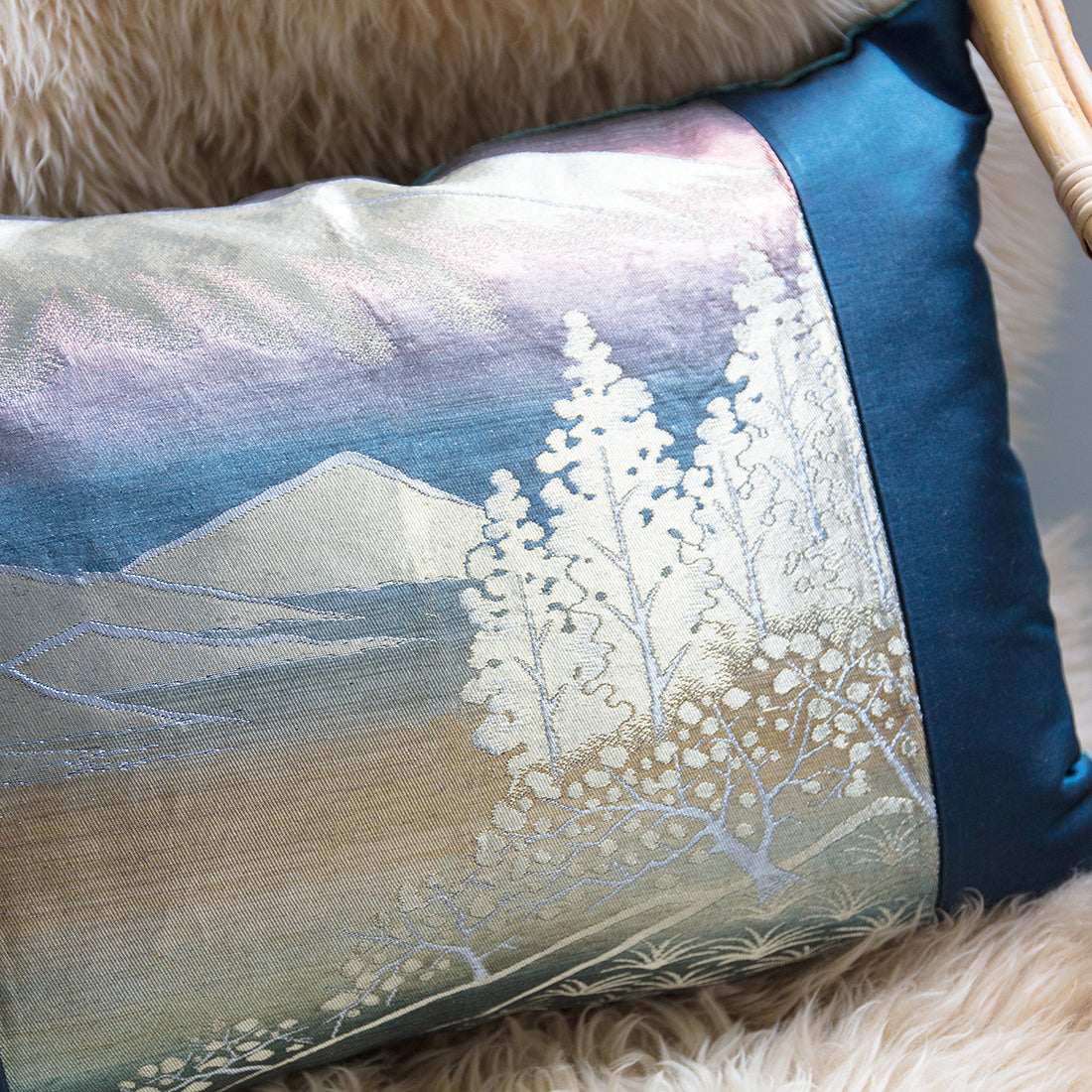 Close-up of the Blue Mountain Silk Velvet Cushion's textured fabric surface highlighting its rich, deep blue hue and subtle