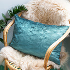 Close-up of the deep blue silk velvet fabric's rich, plush texture with subtle sheen and woven pattern detail on the cushion