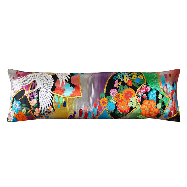 Long bolster cushion made with rainbow silk wedding kimono textile.