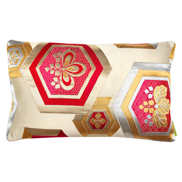 Cream silk obi pillow with red hexagons and kiri flowers by Hunted and Stuffed, London.