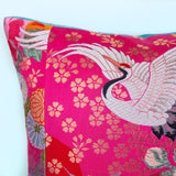 Detail of flying crane pillow in pink silk