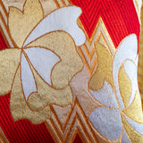 Detail of gold floral pillow with red silk back by Hunted and Stuffed