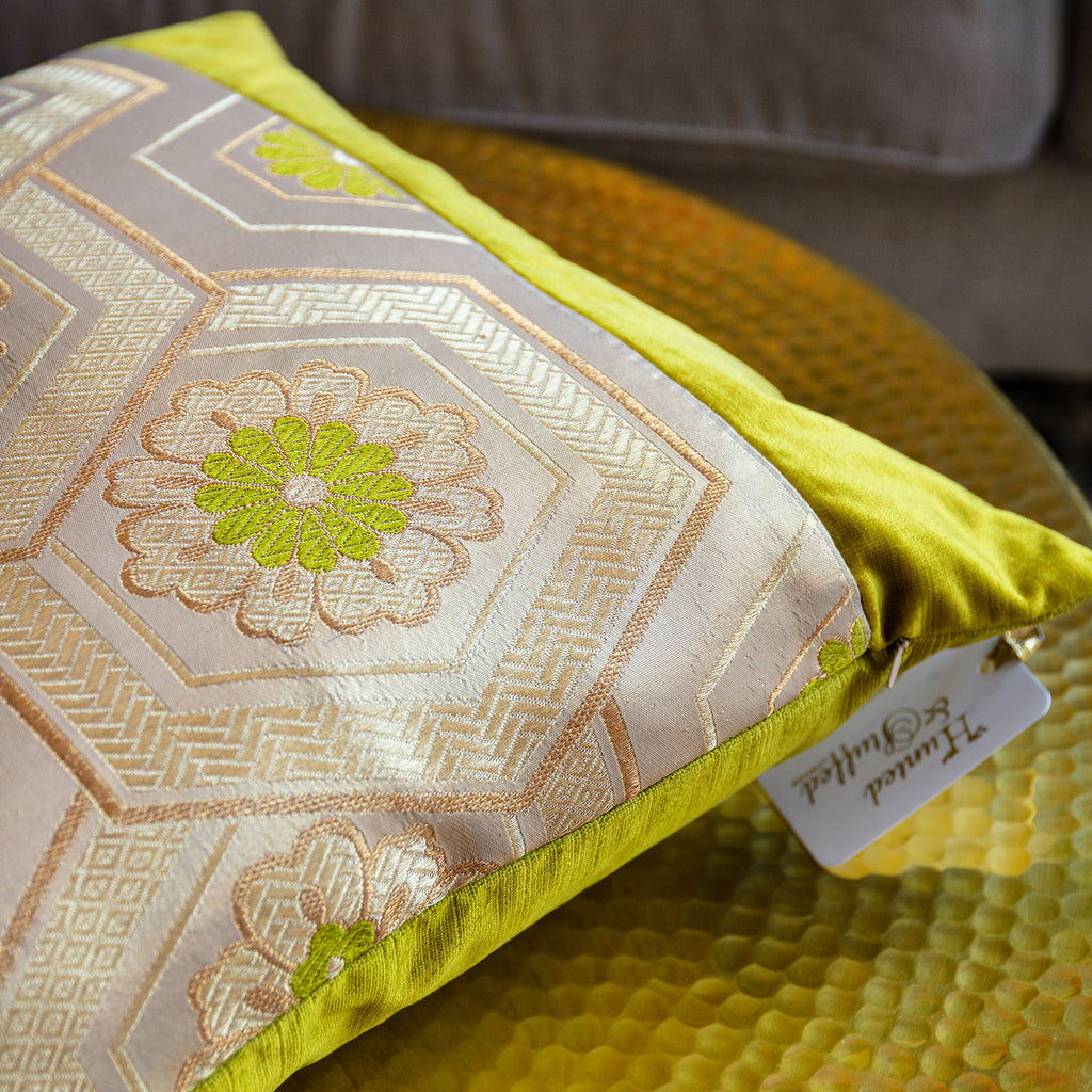 Close-up of the gold obi buckle with intricate baroque detailing against chartreuse velvet fabric; emphasis on textured