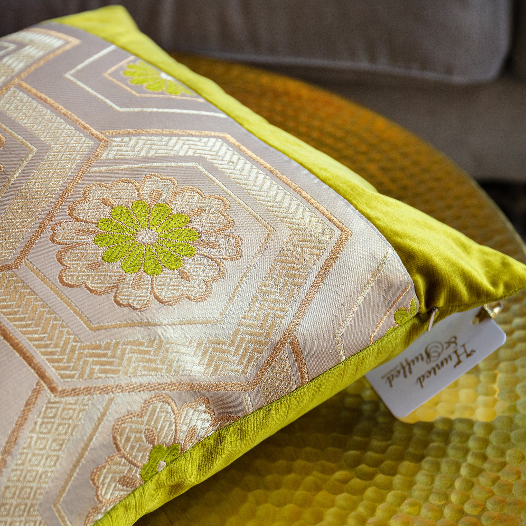 Close-up of the gold obi buckle with intricate baroque detailing against chartreuse velvet fabric; emphasis on textured