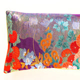 Detail of end of uchikake bolster pillow in purple silk with red and orange flowers