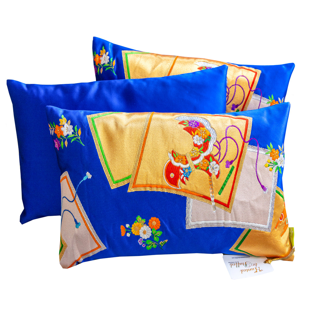 Electric blue square pillows with gold accent obi cushions, plush fabric covers, and 16x16 inch dimensions by Hunted and