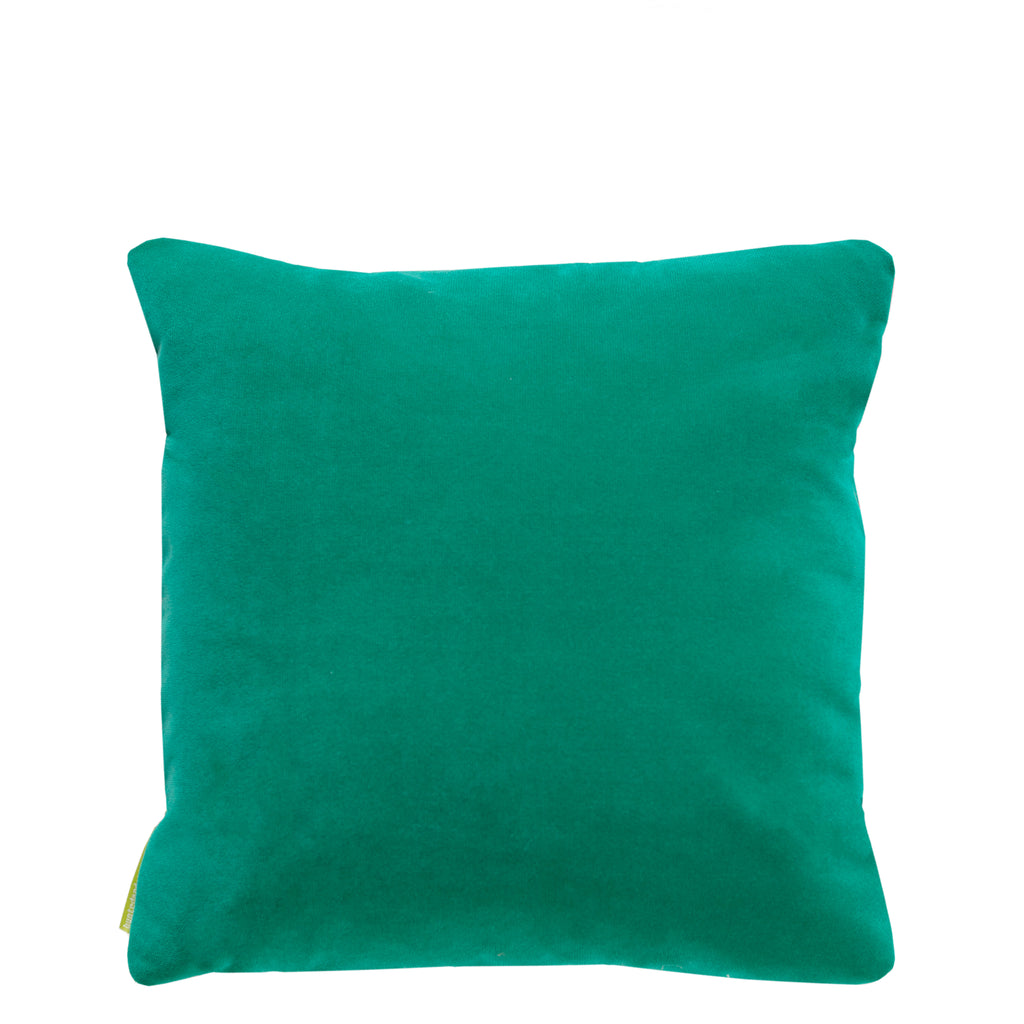 Close-up of the red silk pillow’s textured golden cloud embroidery on emerald velvet fabric at a slight angle