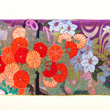 Centre of uchikake kimono bolster pillow showing detail of oarnge flowers and metallic embroidery