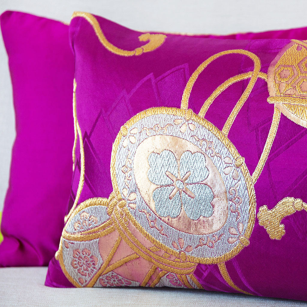 Close-up of gold drum embroidery detail on the textured silk fabric of the Vintage Purple Obi Cushion, emphasizing intricate
