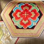 Close-up of gold hexagon embroidery on vintage Obi silk fabric showcasing intricate texture and rich metallic sheen.