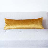 Long bolster pillow with gold velvet reverse
