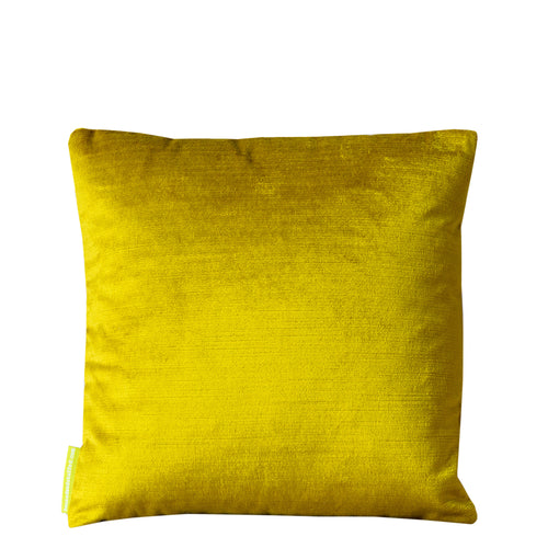 Close-up of gold geometric embroidery detail on the chartreuse velvet Obi pillow’s corner, highlighting textured stitching