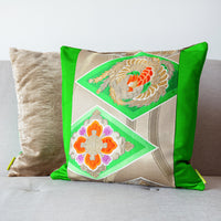 Green oriental cushion in antique obi silk