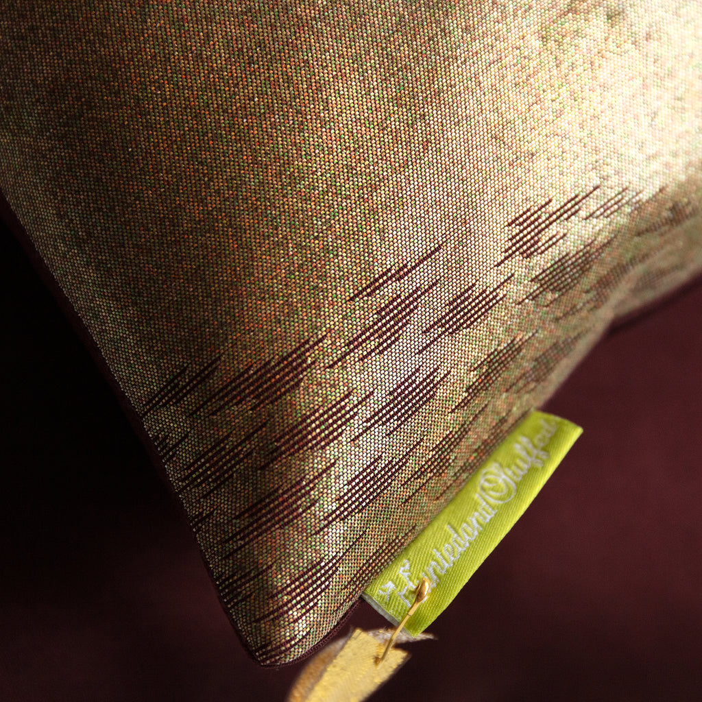Close-up of the textured bronze silk fabric highlighting intricate kimono-inspired weaving and subtle metallic sheen in