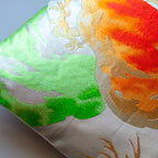 Close-up of vibrant orange and green Matsu Pines embroidery details on the Obi cushion fabric edge