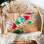 Close-up of gold gilt feather embroidery featuring metallic threads and silk texture on the Hollywood Regency kimono pillow