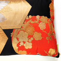 Corner of orange silk pillow by Hunted and Stuffed