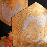 Detail of obi silk pillows, golden phoenix in hexagon