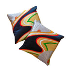 Close-up of the black silk fabric featuring intricate gold floral embroidery and textured weave details.