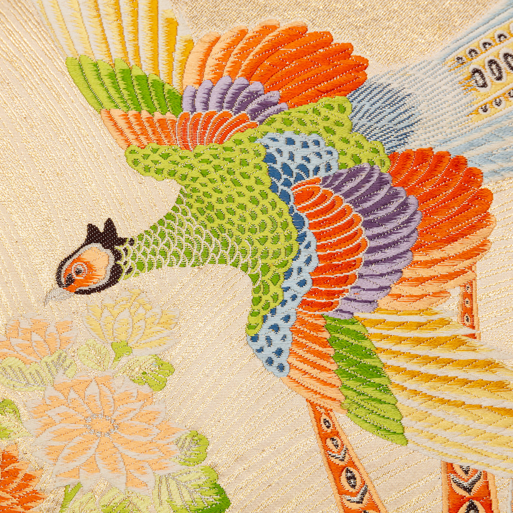 Close-up of cream Maru Obi silk and duck egg blue velvet fabric detail on the Flying Pheasants Pillow, highlighting textured