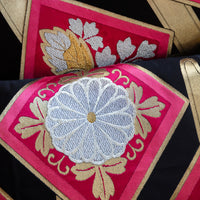 Pink and black throw pillows made with obi silk.