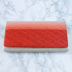 Close-up of the clutch’s ombre fabric texture and intricate fold details, highlighting the vintage kimono-inspired